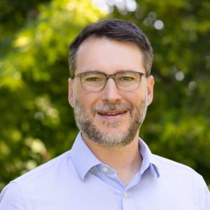 Headshot of erik scher, chief commercial officer at koloma