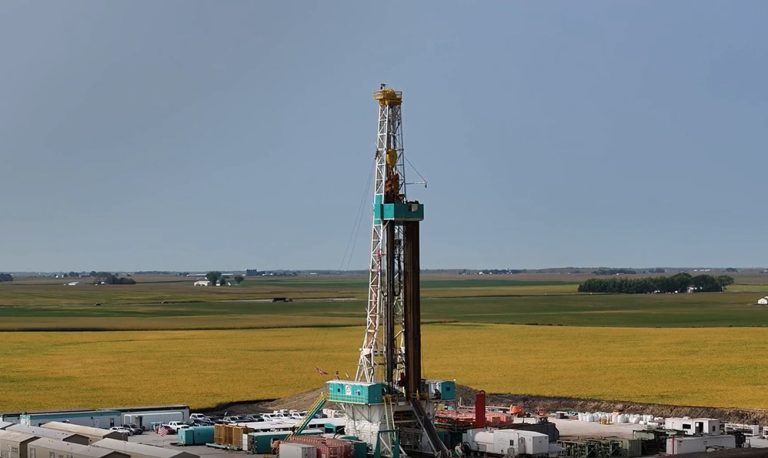 Drilling rig in a grass field