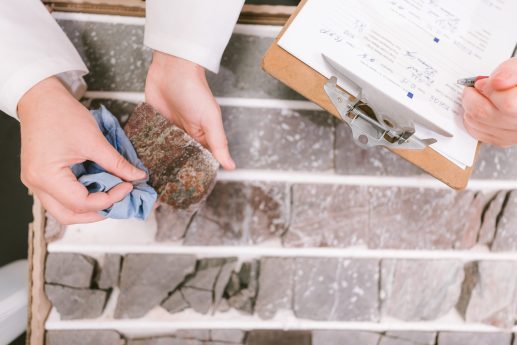 Hands holding geologic sample